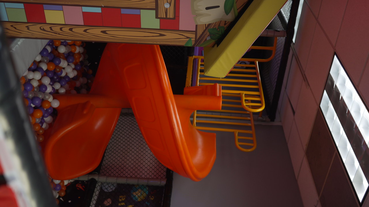 Orange spiral slide into the ball pit at Star Park Cherry Hill